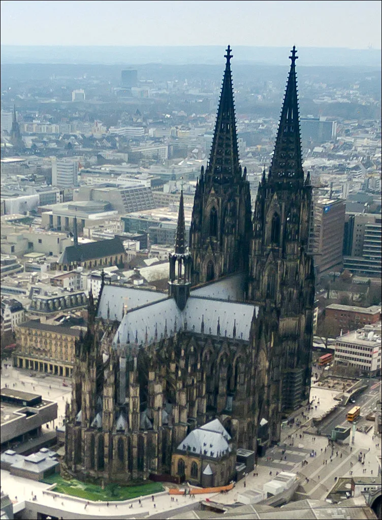 Aerial view of the iconic Cologne Cathedral in Germany, showcasing its twin Gothic spires and detailed architecture — one of the most famous Cologne Cathedral photos