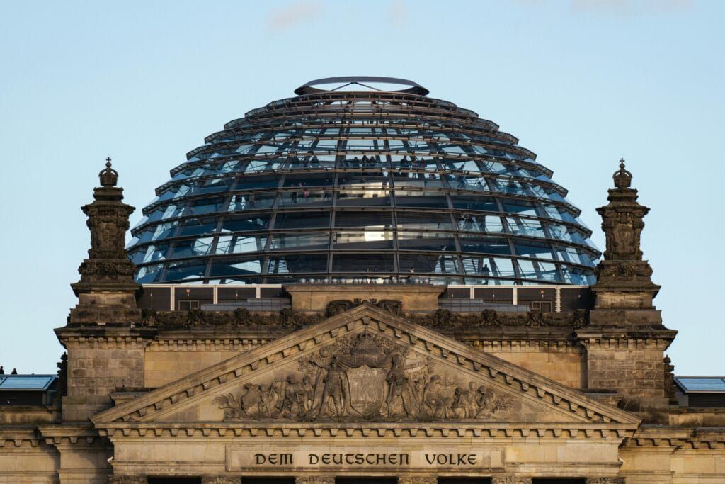 Exterior view of the Reichstag Building in Berlin, Germany, showcasing its historic architecture and glass dome