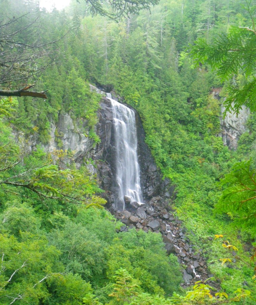 OK Slip Falls cascading down the Adirondack Mountains, with mist rising from the falls