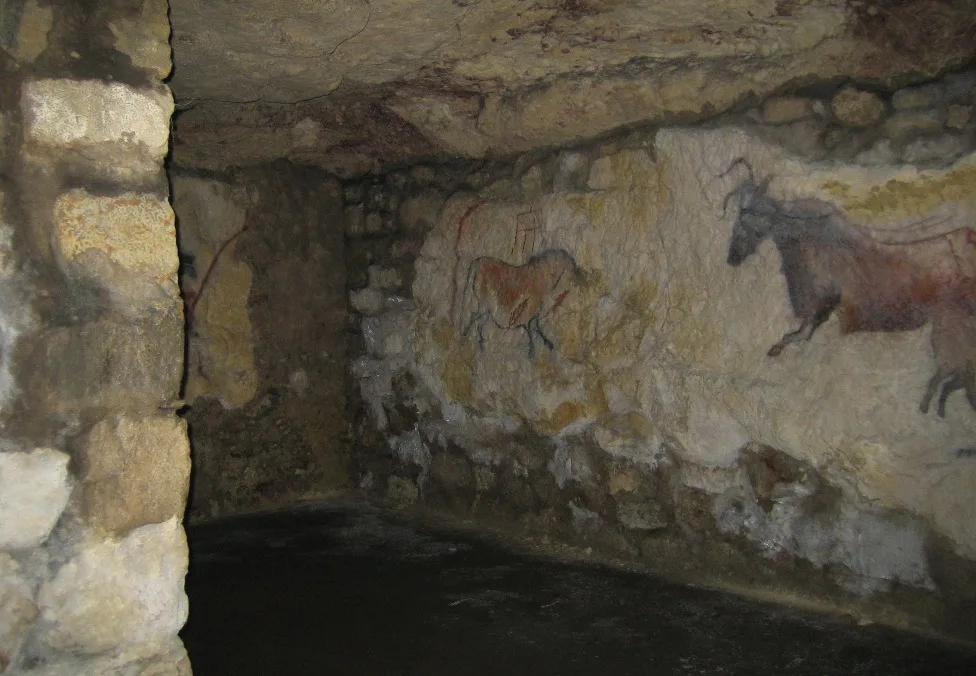 Ancient cave painting on the stone wall inside the Labyrinth in Buda Castle, Budapest—a historic underground attraction beneath Castle Hill.