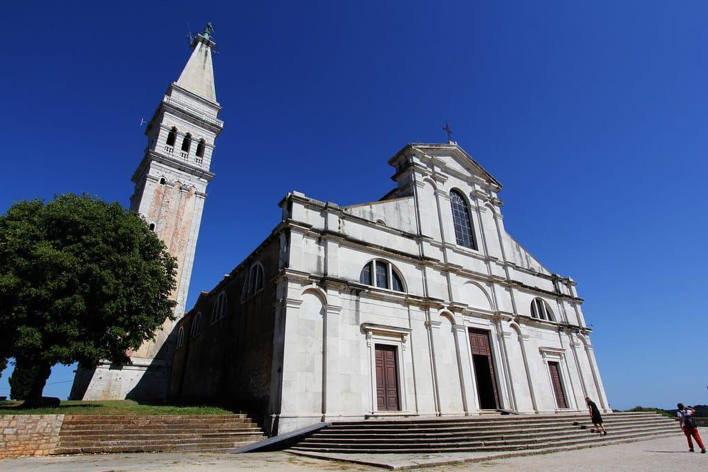 St Euphemia Church in Rovinj, Croatia, a historic building with a bell tower under a blue sky, an Istria tourist attraction.
