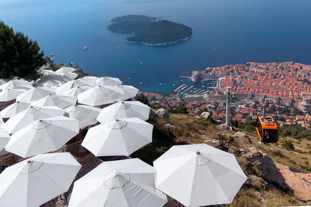 The orange cable car in Dubrovnik takes you to a peak on Mount Srđ with spectacular views over the coast.