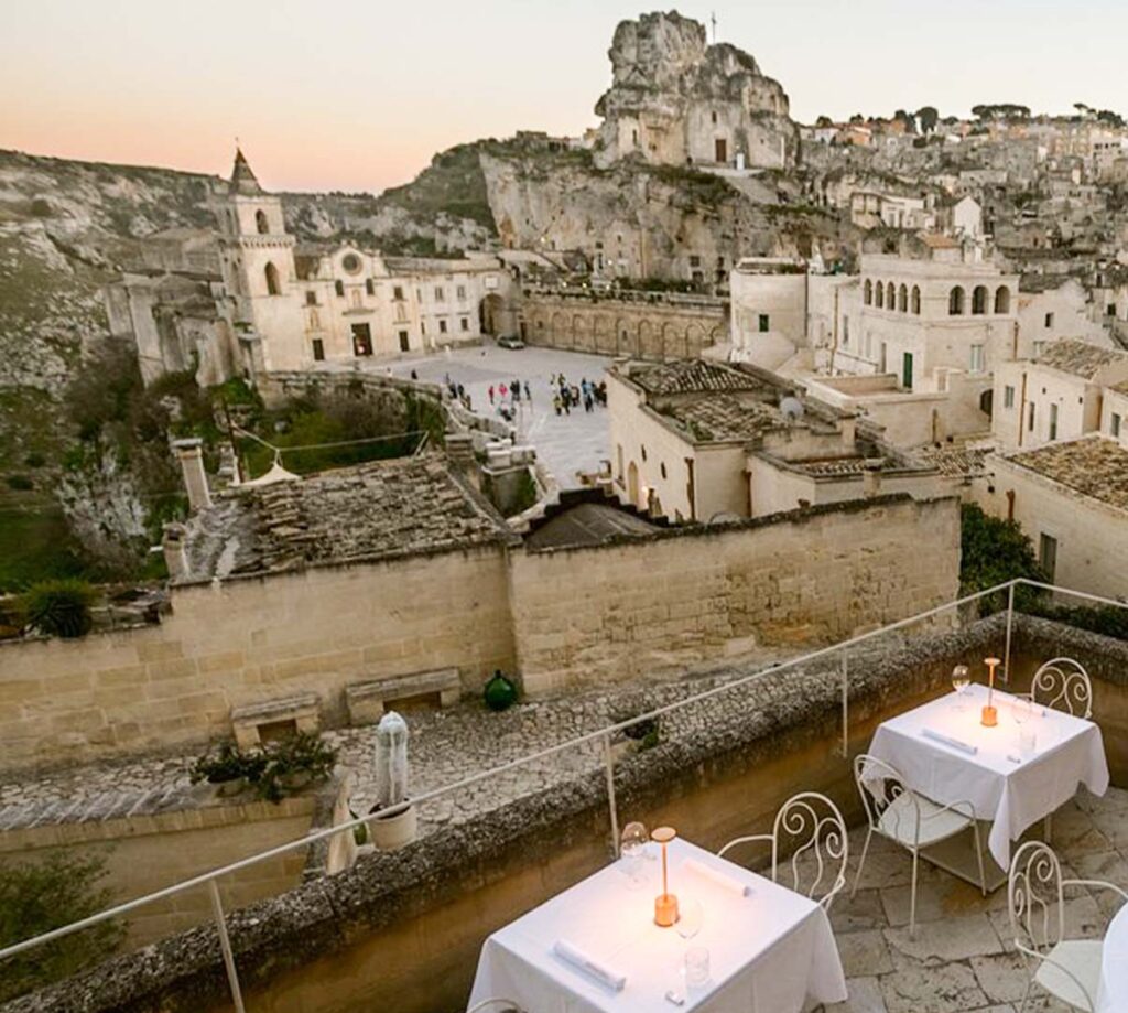 panoramic terrace with tables overlooking Sassi di Matera Italy