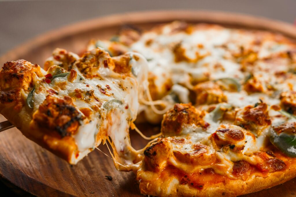 A delicious cheese pizza served fresh at one of the best restaurants in Downtown Miami, highlighting Pizza & American Favorites where I found the best Downtown Miami slices.