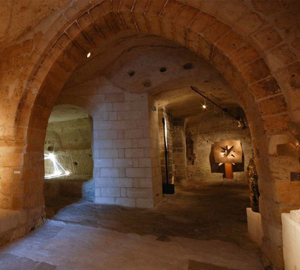 modern sculpture displayed in cave-like room inside MUSMA Matera Italy