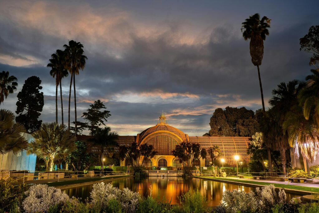 Beautiful Spanish Colonial Revival architecture with reflecting pool and colorful gardens at Balboa Park San Diego