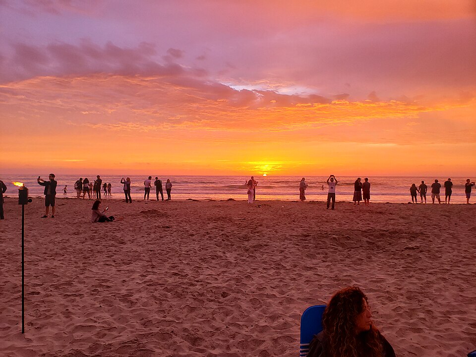 Family playing on the sand at La Jolla Shores Beach – one of the best free Things to Do in San Diego with Kids