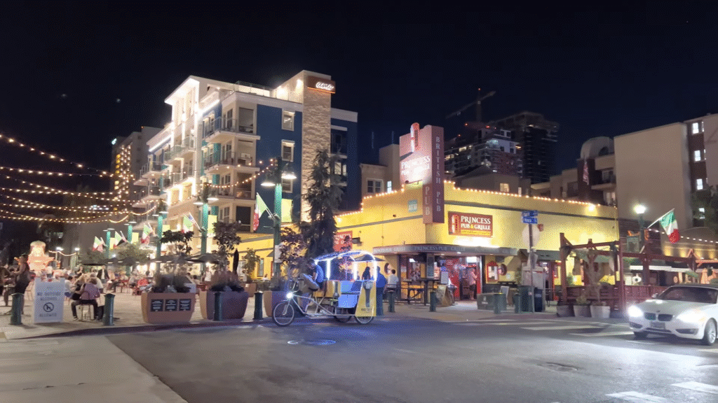 Little Italy evening scene with vibrant restaurants and street lights, showcasing popular things to do in San Diego at night