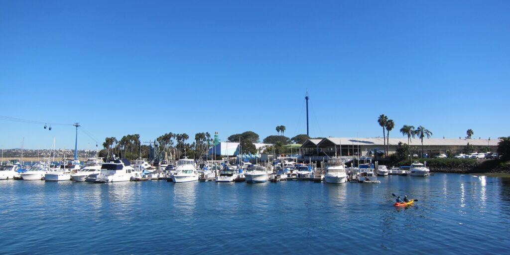 Family kayaking on Mission Bay during a sunny day – one of the best Things to Do in San Diego with Kids
