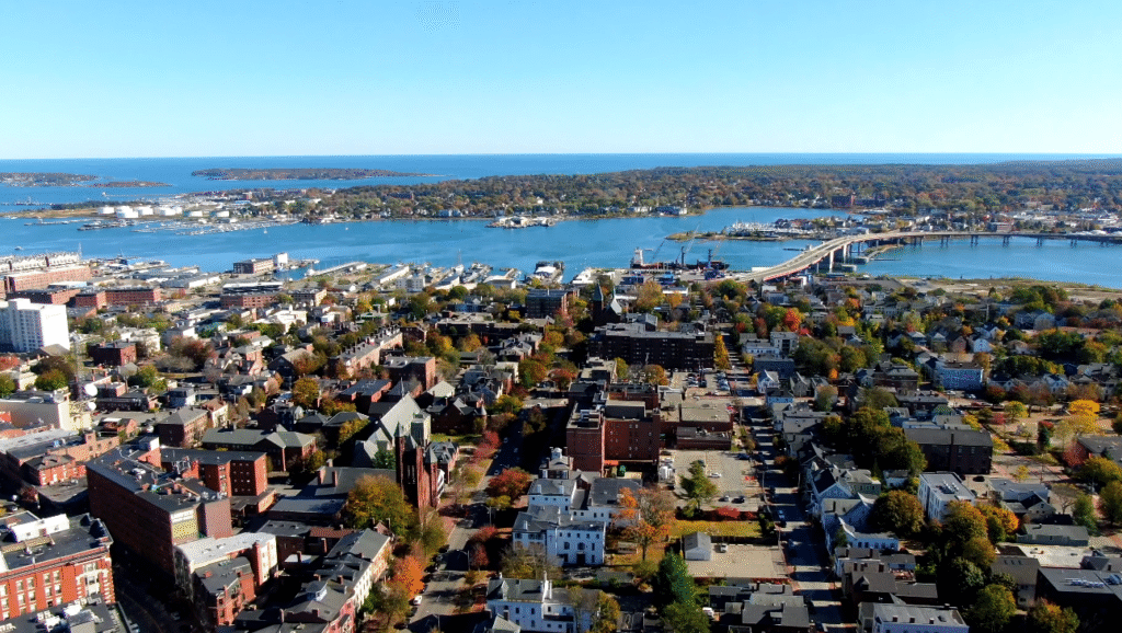 Visitors walking from the Old Port District toward the Portland Maine Greek Festival on a sunny day