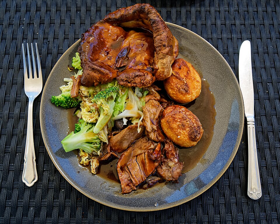 Lamb dinner plate with roasted potatoes and salad served at the Portland Maine Greek Festival