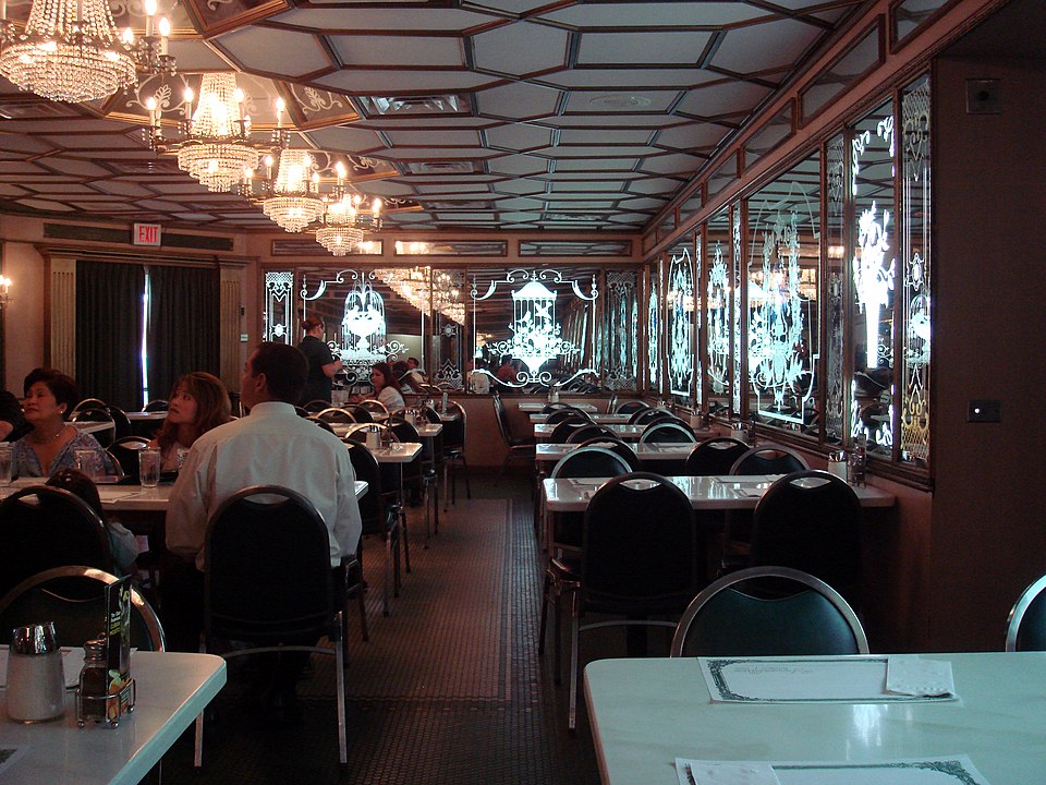 Dining experience at Versailles Restaurant, one of the top things to do in Little Havana, Miami, featuring authentic Cuban cuisine and vibrant local culture