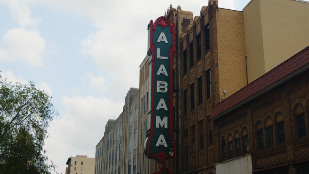 Historic Alabama Theatre building with its iconic vertical “ALABAMA” marquee sign in downtown Birmingham — a top thing to do in Birmingham AL