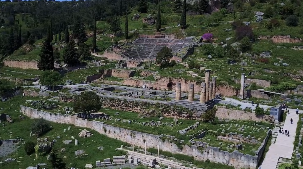 Ancient ruins of Delphi in Greece with the Temple of Apollo and hillside theater, a popular historical day trip from Athens, Greece