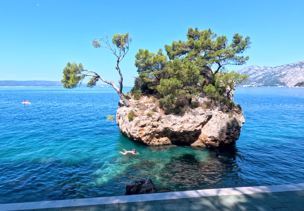 Crystal-clear water and the famous Brela Stone at Punta Rata Beach in Croatia