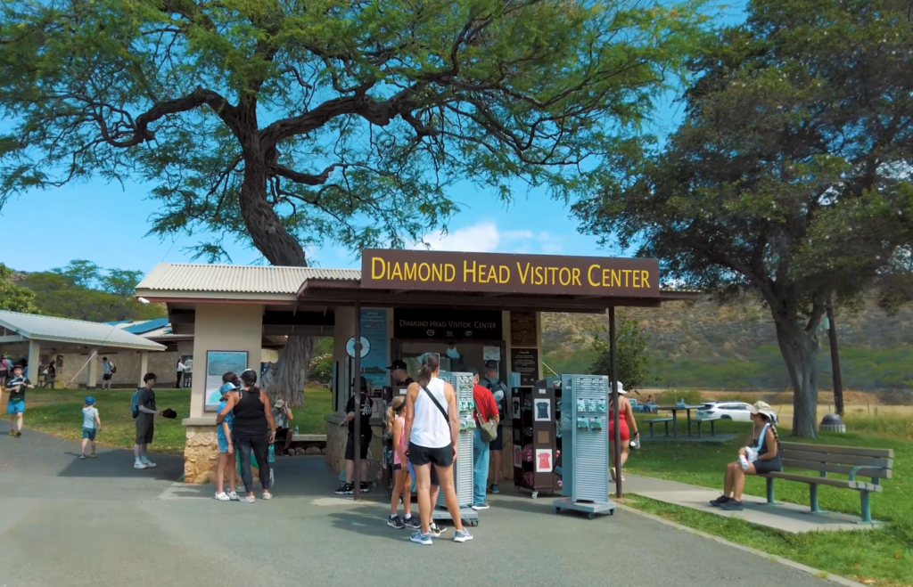 Diamond Head Visitor Center at the trailhead of Diamond Head Crater, one of the best hikes on Oahu Hawaii, with hikers preparing to start one of the best hikes on Oahu.