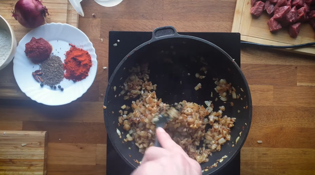 Golden caramelized onions in a heavy pot ,goulash czech food