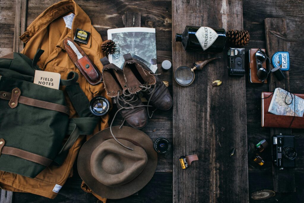 Essential hiking gear for Jordan Pond Path including water bottle sunscreen bug spray and downloaded trail map