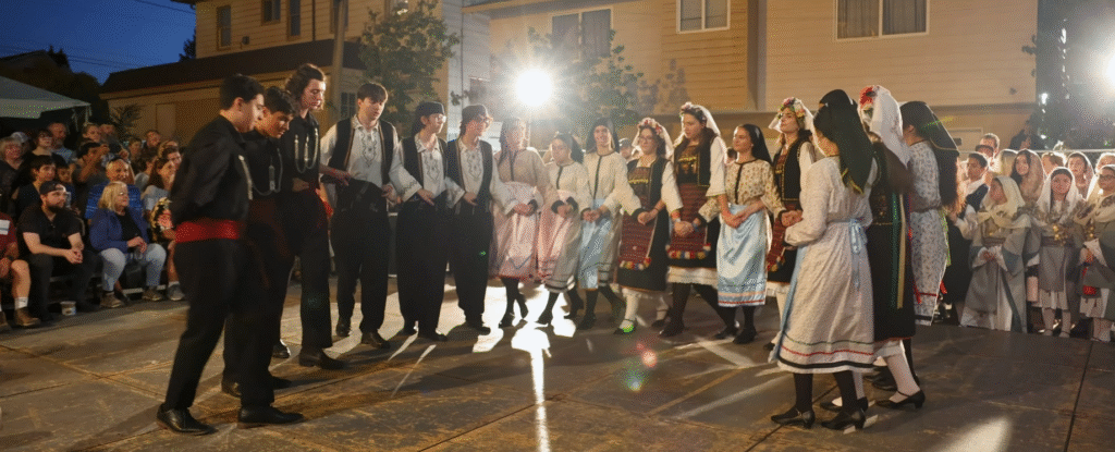 Live Greek band performing while visitors dance at the Portland Maine Greek Festival.