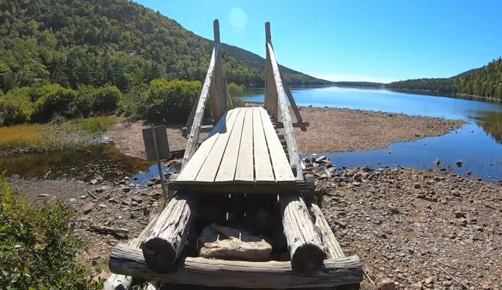 mall wooden bridge crossing stream onjordan pond path trailhead western shore trail