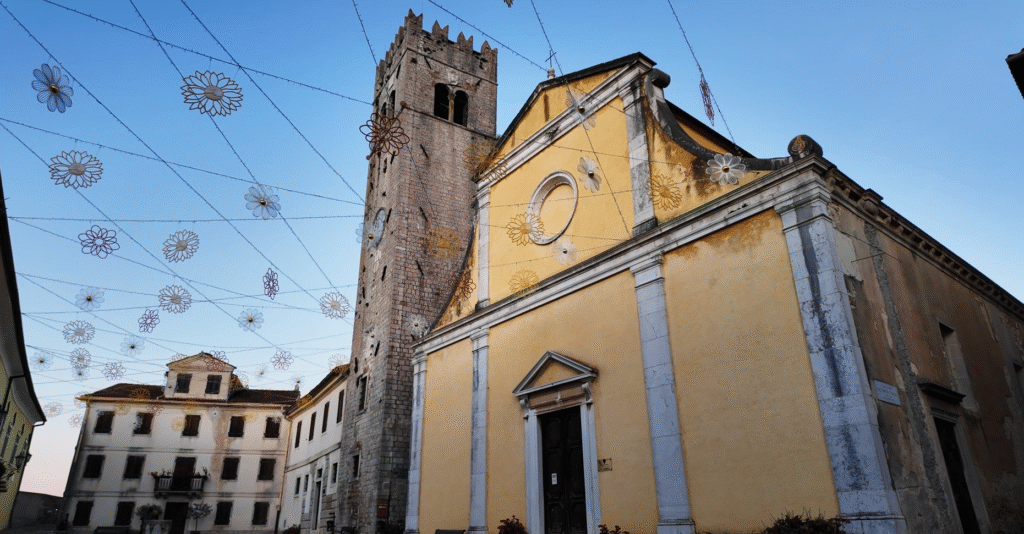 St. Stephen’s Church Motovun with its prominent bell tower, featuring classic Istrian architecture overlooking the medieval streets of Motovun, Croatia