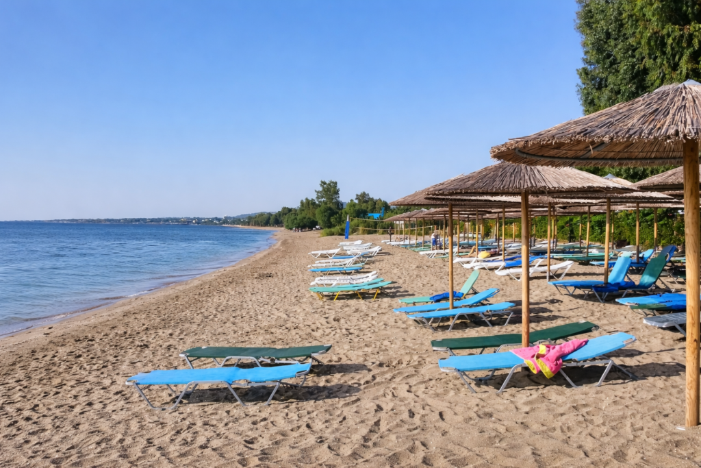 Crystal clear shallow waters and soft golden sand at Marathon Beach Greece